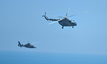 Chinese military helicopters fly past Pingtan island