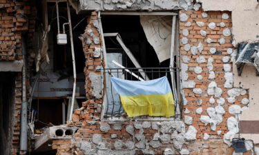 Videos alleged to show Russian soldiers castrating and killing a bound and gagged Ukrainian soldier are circulating on social media. A Ukrainian national flag hangs from a balcony of a destroyed building in Irpin
