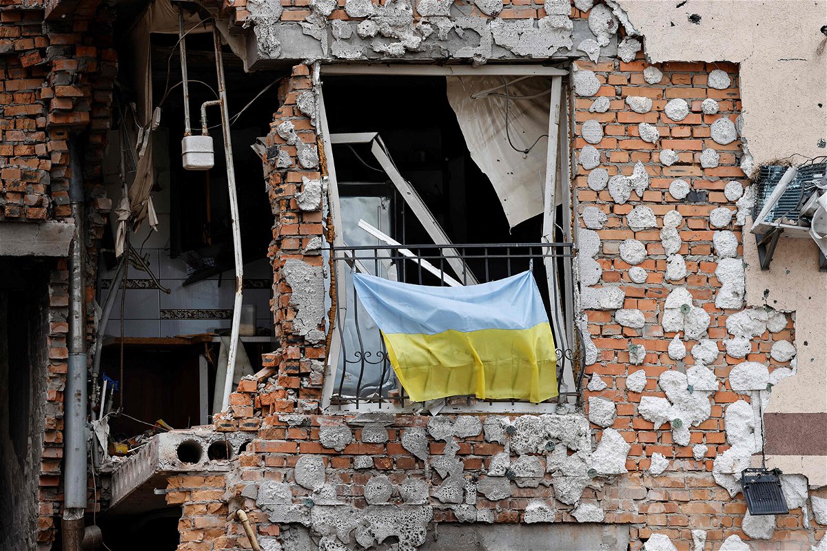 <i>Ludovic Marin/Pool/AFP/Getty Images</i><br/>Videos alleged to show Russian soldiers castrating and killing a bound and gagged Ukrainian soldier are circulating on social media. A Ukrainian national flag hangs from a balcony of a destroyed building in Irpin