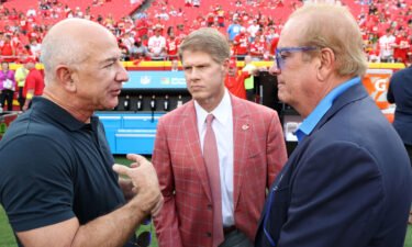 Jeff Bezos with Chiefs owner Clark Hunt and Chargers owner Dean Spanos ahead of a Thursday night football game at Arrowhead Stadium.