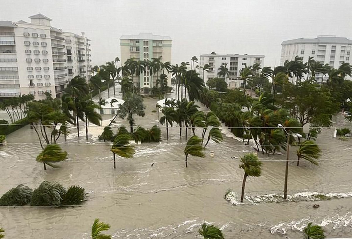 <i>City of Naples</i><br/>Search and rescue teams are working before dawn to respond to hours-old calls for help that came as Ian slammed the state's west coast as a Category 4 hurricane. A flooded Gulfshore Boulevard in Naples Florida on September 28