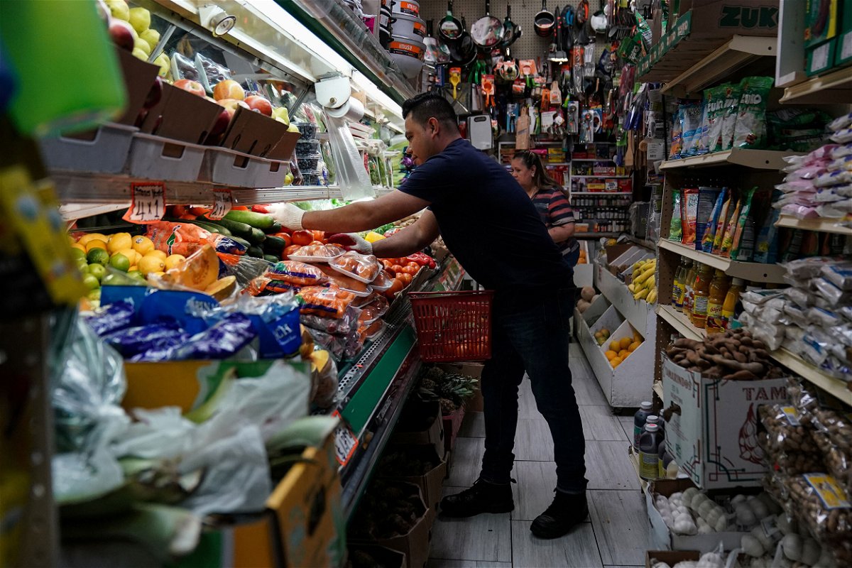 <i>Sarah Silbiger/Reuters</i><br/>3 things the Fed needs to see before it stops hiking rates. A person is seen here arranging groceries in El Progreso Market in the Washington