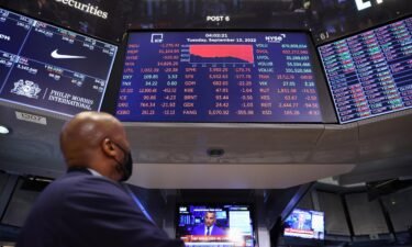 US stocks fell on September 16 after FedEx served investors a brutal pre-earnings announcement about the state of the global economy. A trader is seen here looking at a screen showing the Dow Jones Industrial Average on the trading floor at the NYSE.