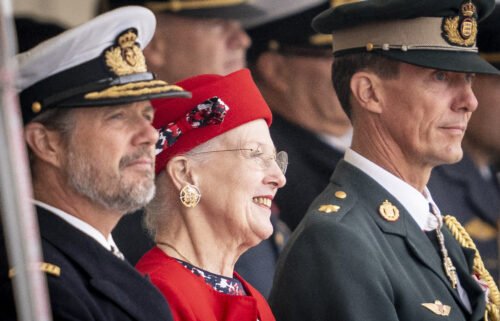 Queen Margrethe is flanked by her sons Crown Prince Frederik (L) and Prince Joachim (R) as she attends festivities in Korsoer