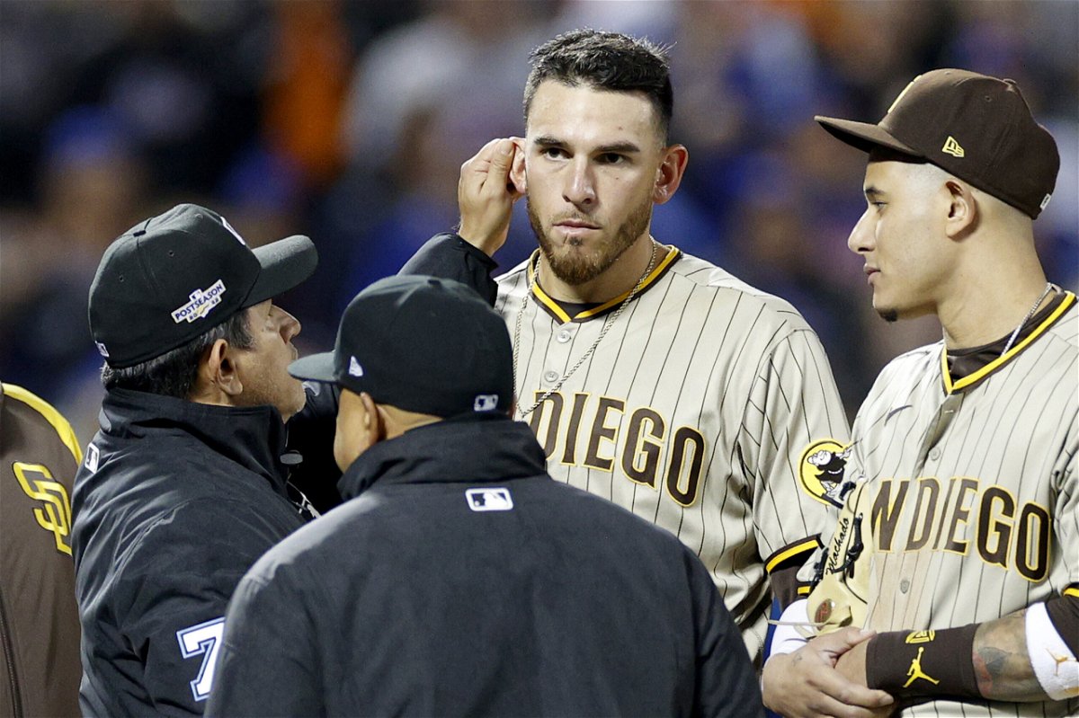<i>Sarah Stier/Getty Images</i><br/>Crew chief Alfonso Marquez checks the ear of Joe Musgrove during the game between the Padres and the Mets.