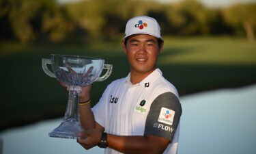 Tom Kim of South Korea poses with the trophy after winning the Shriners Children's Open at TPC Summerlin on October 09