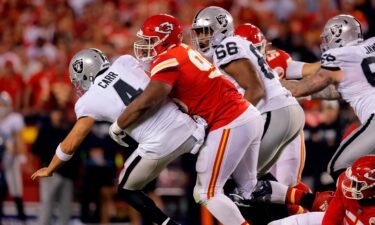 Derek Carr is tackled by Chris Jones after which a roughing-the-passer penalty call was called.