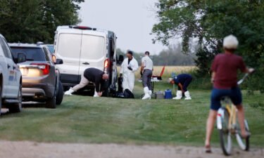 A police forensics team investigates a crime scene after multiple people were killed last month in Saskatchewan