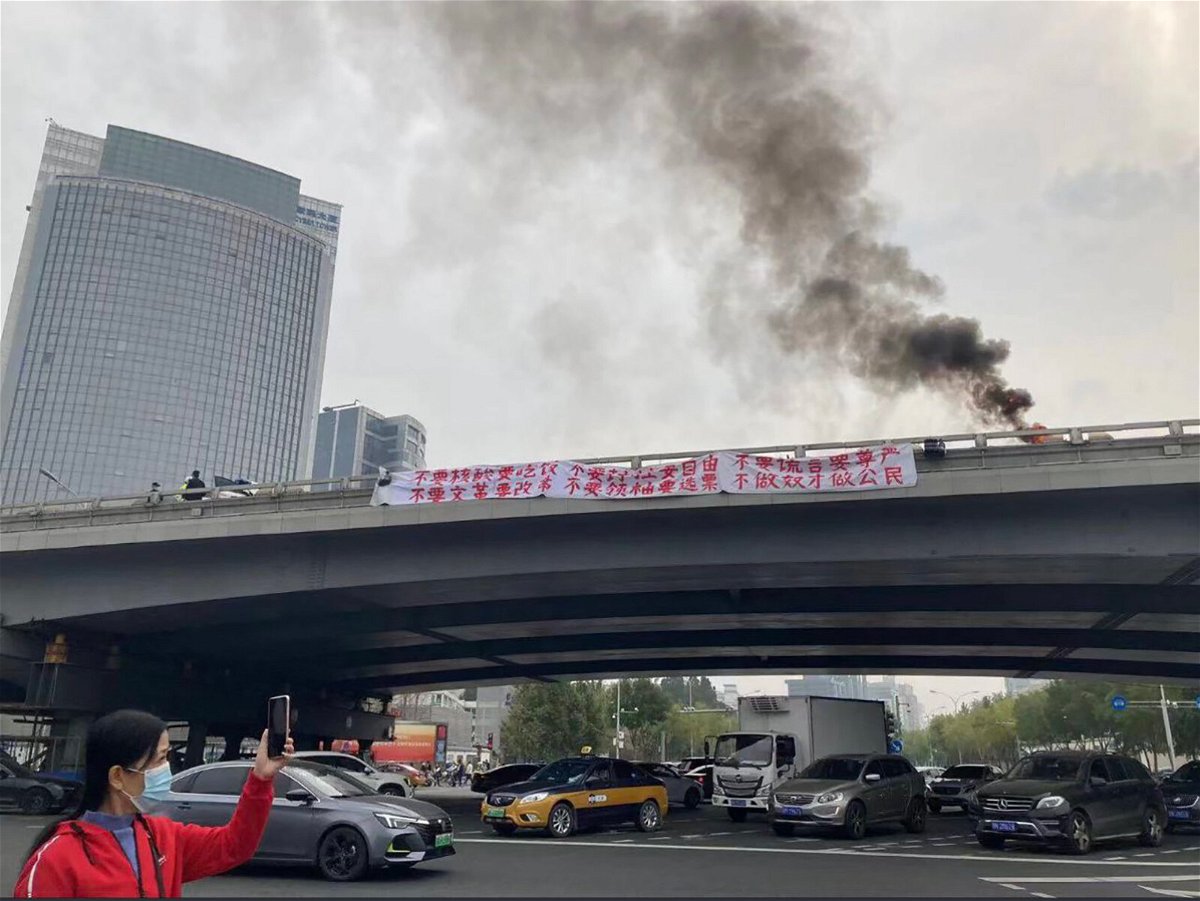 <i>Twitter</i><br/>A banner is seen on Sitong Bridge in Beijing on October 13.
