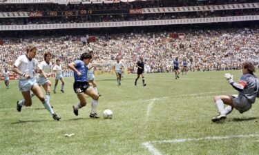 Maradona scores against England at the 1986 World Cup in Mexico.