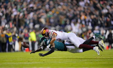 Commanders cornerback Benjamin St-Juste knocks the ball from Eagles wide receiver Quez Watkins.