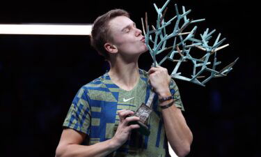 Holger Rune celebrates winning the Paris Masters title against Novak Djokovic.