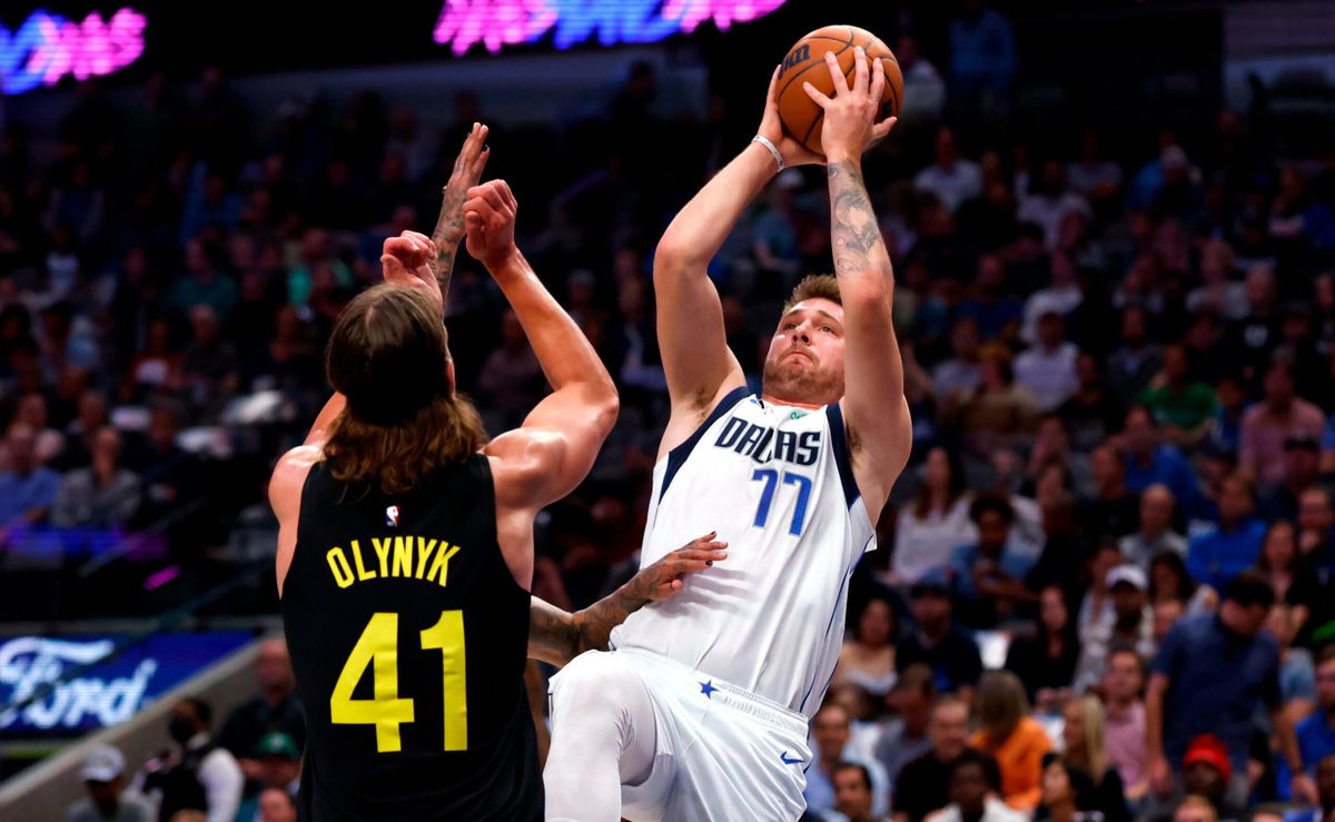 <i>Ron Jenkins/Getty Images</i><br/>Doncic shoots over Kelly Olynyk of the Utah Jazz in the first half at American Airlines Center on November 2.