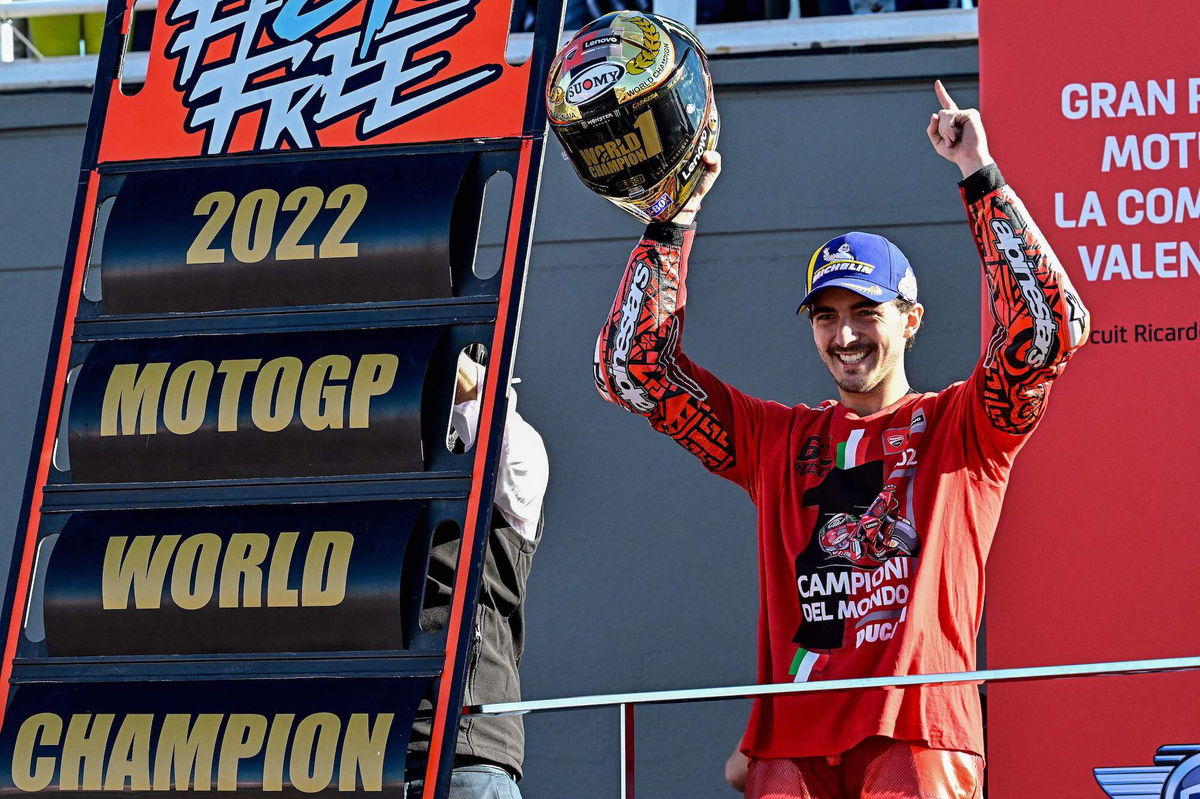 <i>Javier Soriano/AFP/Getty Images</i><br/>Bagnaia celebrates as he won the world championship.