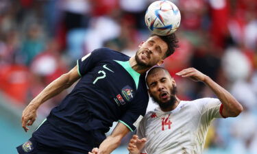 Mathew Leckie of Australia competes for a header against Aissa Laidouni of Tunisia during Group D match between Tunisia and Australia.