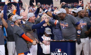 Dusty Baker (center right) celebrates with his team in Houston on November 5.