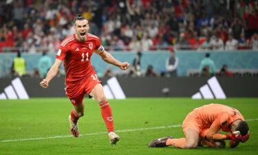 Gareth Bale celebrates after scoring their team's equalizer at the Ahmad Bin Ali Stadium.