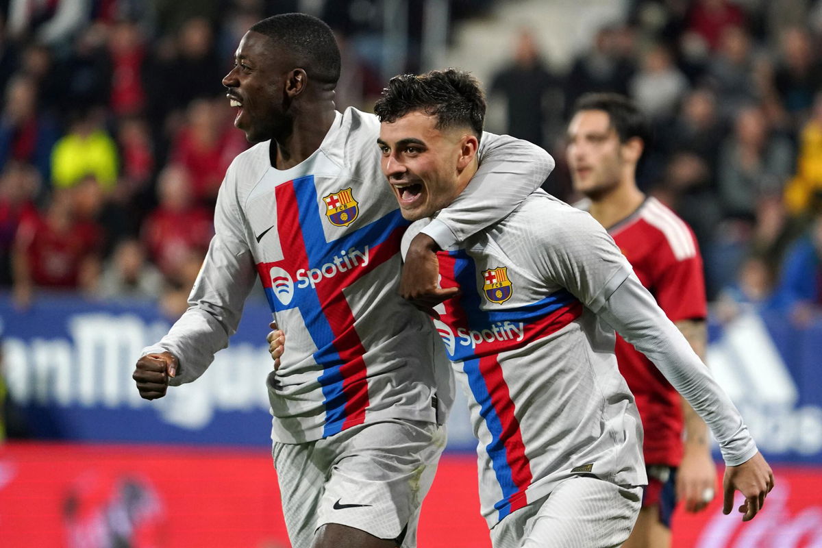 <i>CESAR MANSO/AFP/AFP via Getty Images</i><br/>Pedri celebrates Barça's first goal against Osasuna with Ousmane Dembélé.