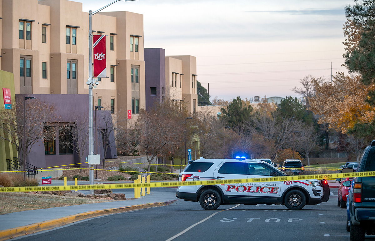 <i>Adolphe Pierre-Louis/AP</i><br/>New Mexico State Police assists APD officers in investigating a deadly overnight shooting on the University of New Mexico campus Saturday.