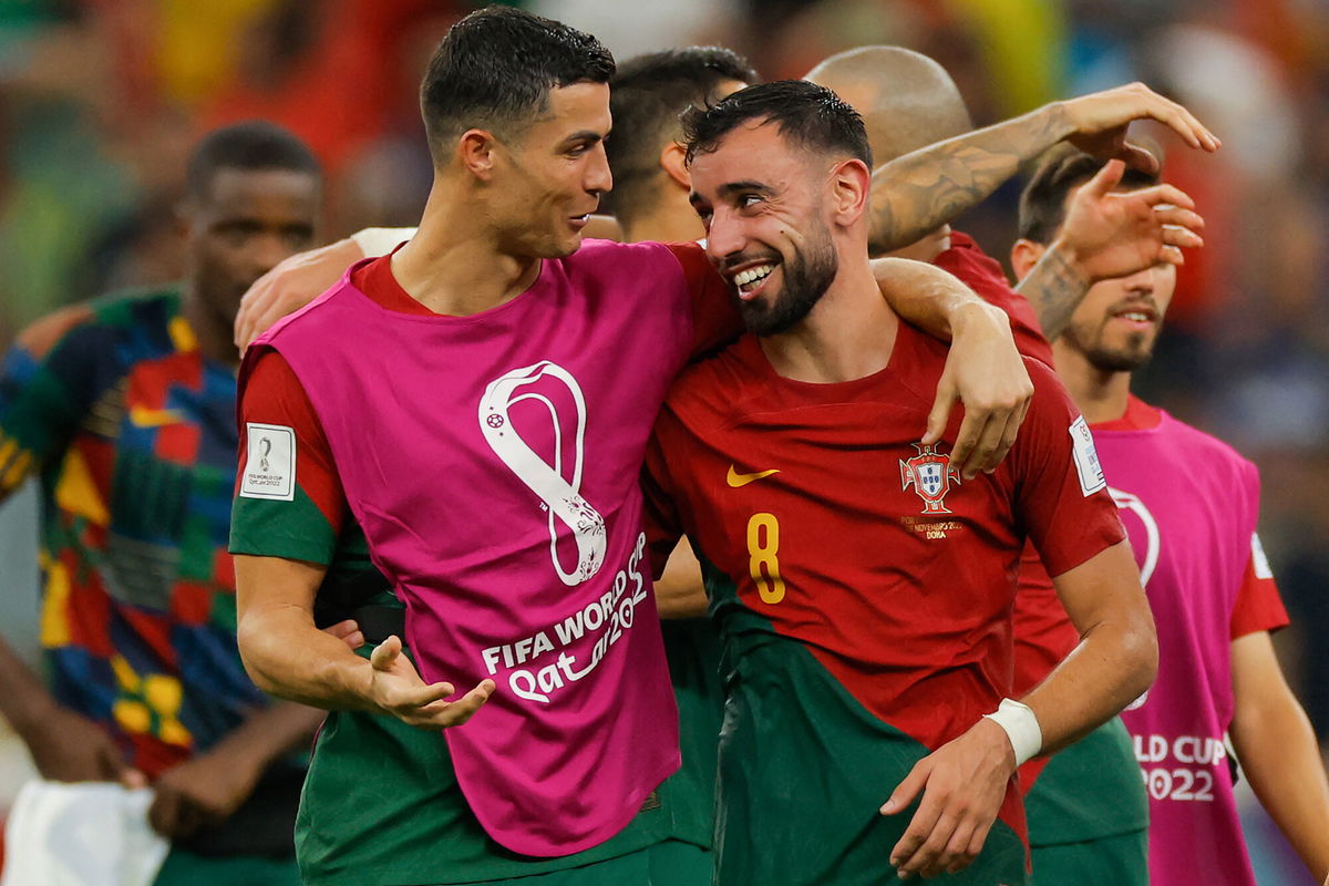 <i>Odd Andersen/AFP/Getty Images</i><br/>Cristiano Ronaldo and Bruno Fernandes celebrate after Portugal beat Uruguay at 2022 World Cup.