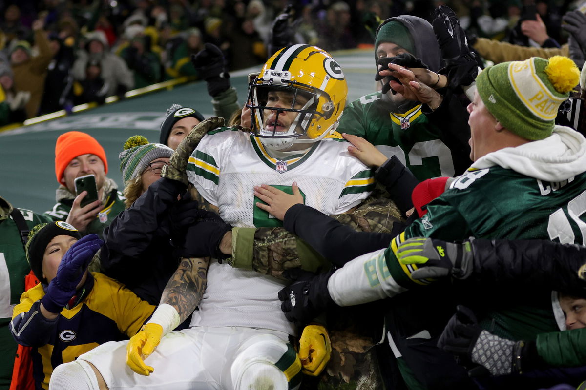 <i>Stacy Revere/Getty Images</i><br/>Christian Watson celebrates scoring a touchdown against the Titans at Lambeau Field.