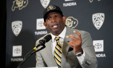 Deion Sanders speaks after being introduced as the new head football coach at the University of Colorado.