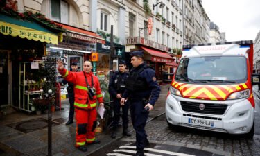 French police and firefighters secure a street in Paris