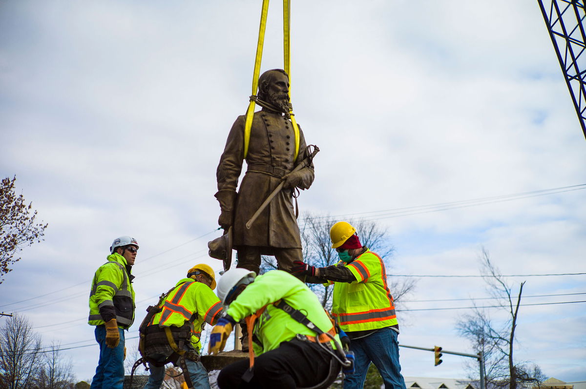 <i>John C. Clark/AP</i><br/>Workers in Richmond