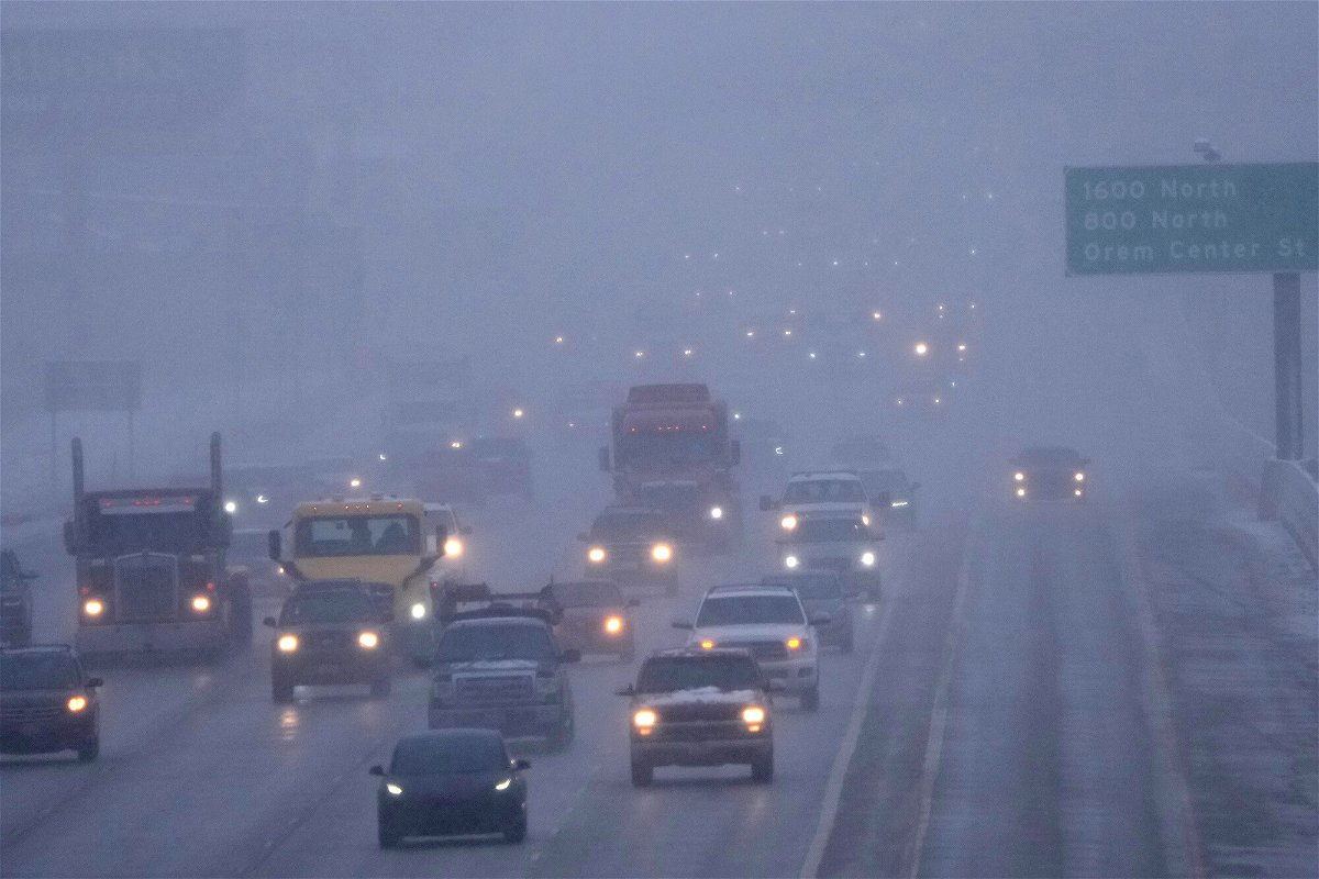 <i>George Frey/AFP/Getty Images</i><br/>Cars drive north on I-15 after an overnight storm in Lehi