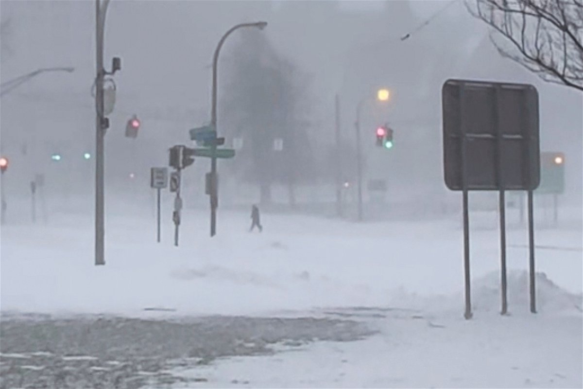 <i>AP</i><br/>High winds and snow covers the streets and vehicles in Buffalo
