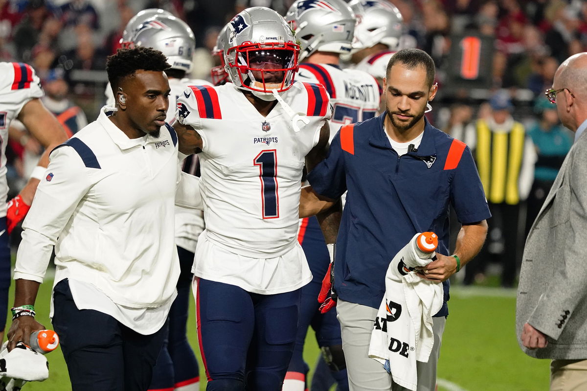 <i>Darryl Webb/AP</i><br/>New England Patriots wide receiver DeVante Parker is carried off the field after a play against the Arizona Cardinals during the first half of an NFL game on Dec. 12