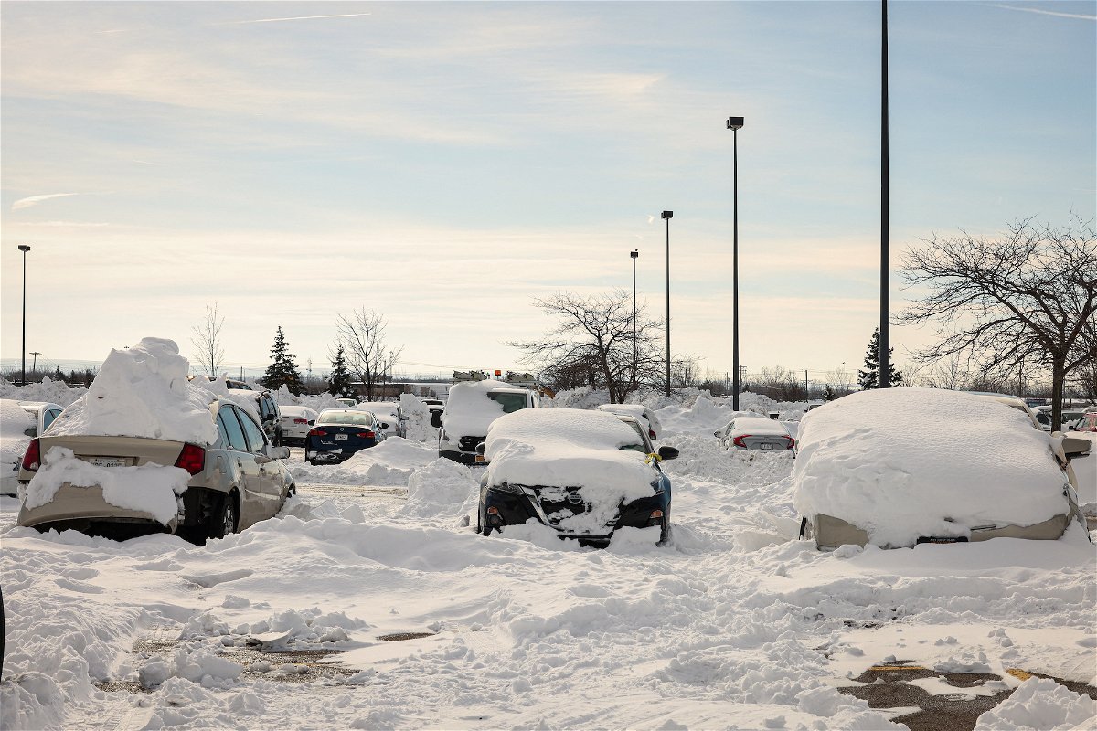 <i>Lindsay DeDario/Reuters</i><br/>Abandoned cars are piled in snow after being towed to a parking lot following a winter storm in Buffalo
