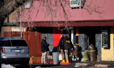 Law enforcement investigators exit Club Q on November 22 in Colorado Springs