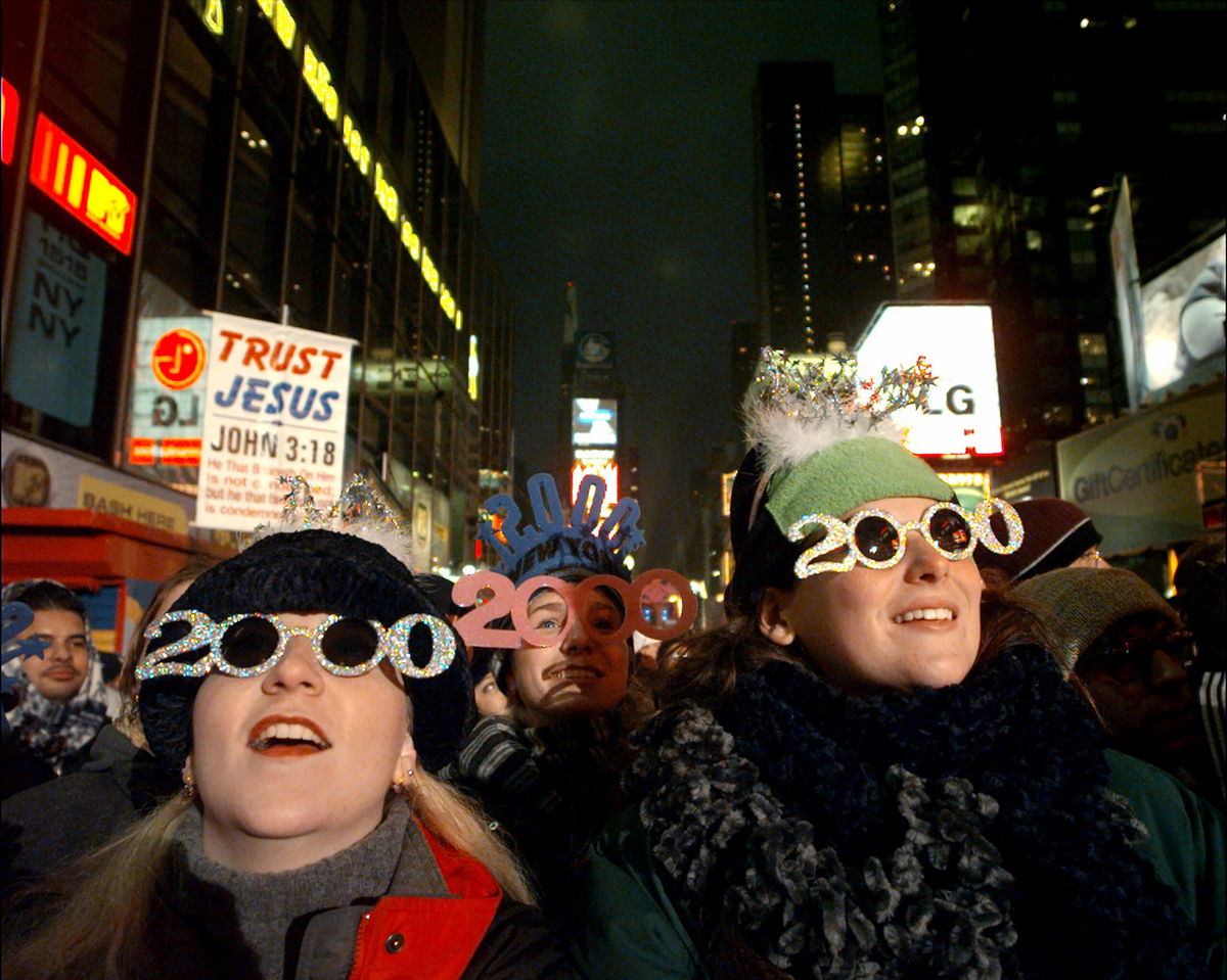 <i>Susan Watts/NY Daily News Archive/Getty Images</i><br/>Y2K throwback: Crowds gathered in New York's Times Square to celebrate the new millennium.