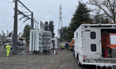 A Tacoma Power crew works at an electrical substation damaged by vandals on December 25 in Graham