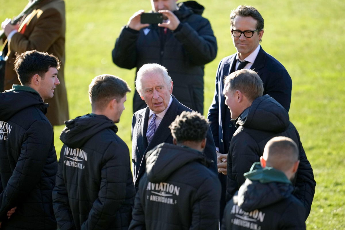 <i>Christopher Furlong/Getty Images Europe/Getty Images</i><br/>King Charles spoke with manager Phil Parkinson and some of the Wrexham players.