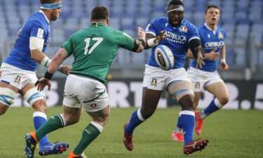 Ireland's Cian Healy (C) and Italy's Cherif Traore (R) in action during the Six Nations in February 2021.