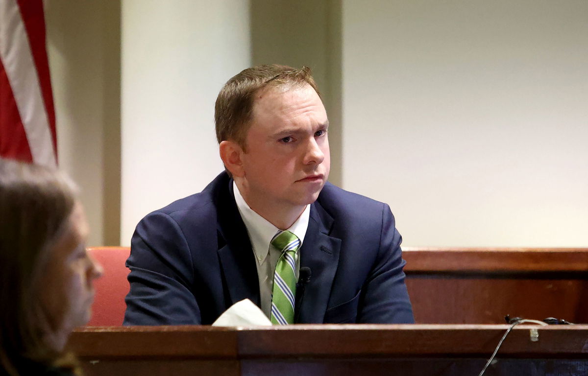 <i>Amanda McCoy/Pool/Star-Telegram/AP</i><br/>Aaron Dean testifies in his defense last week at his murder trial in the death of Atatania Jefferson. Dean was sentenced to nearly 12 years in prison on December 20.