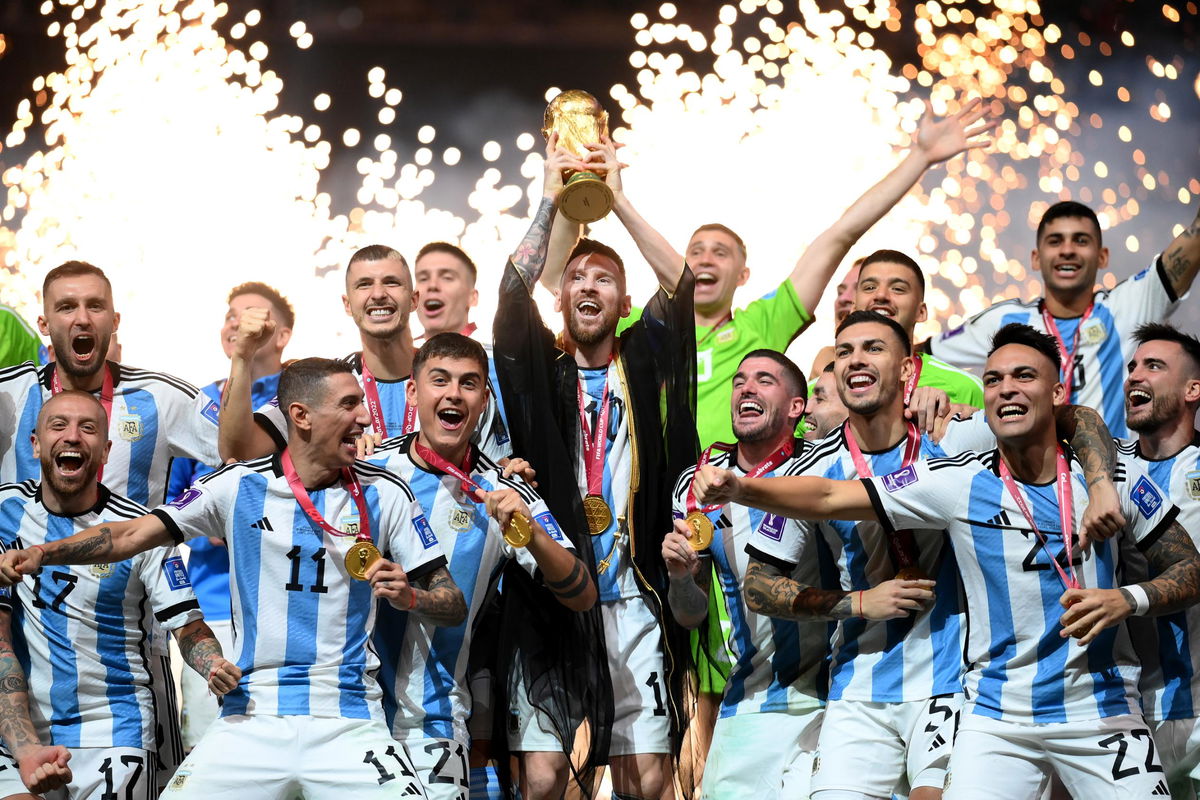 <i>Shaun Botterill/FIFA/Getty Images</i><br/>Botterill also snapped this image of the trophy lift where Messi is wearing a a black and gold bisht -- a traditional item of clothing worn in the region for special events and celebrations.