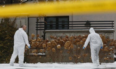 Forensic investigators gather evidence outside the home of Barry and Honey Sherman