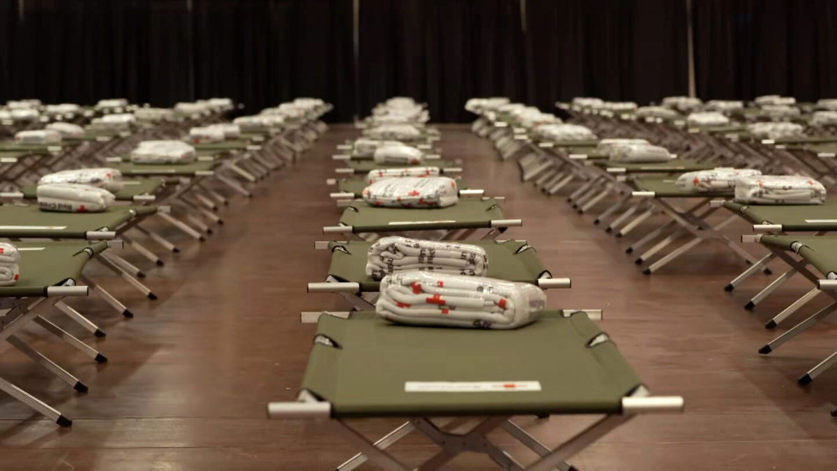 <i>CNN</i><br/>Beds are prepared for migrants at the El Paso Convention Center.