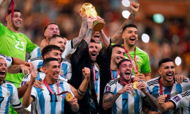 The bisht worn by Lionel Messi (center) during World Cup celebrations has split opinion.