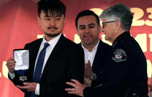Brandon Tsay (left) was given a standing ovation during a ceremony to honor him on January 29.