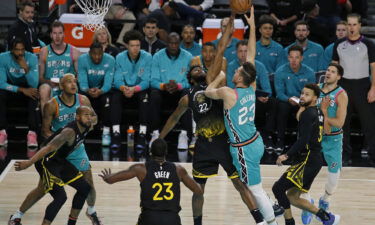 Andrew Wiggins #22 of the Golden State Warriors blocks the shot of Zach Collins #23 of the San Antonio Spurs n the first half at Alamodome on January 13