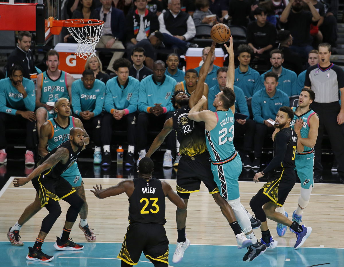 <i>Ronald Cortes/Getty Images</i><br/>Andrew Wiggins #22 of the Golden State Warriors blocks the shot of Zach Collins #23 of the San Antonio Spurs n the first half at Alamodome on January 13