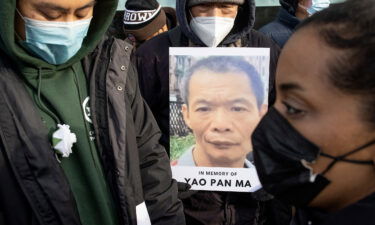 A memorial vigil is held for Yao Pan Ma on the street corner where he was beaten