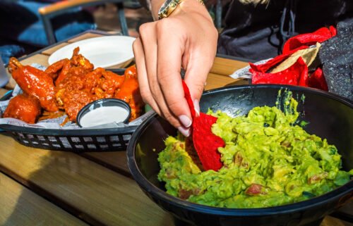 Chicken wings and guacamole will cost less this year.