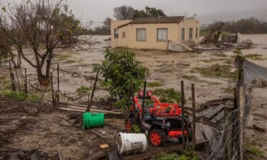 Flood waters inundate a home by the Salinas River near Chualar