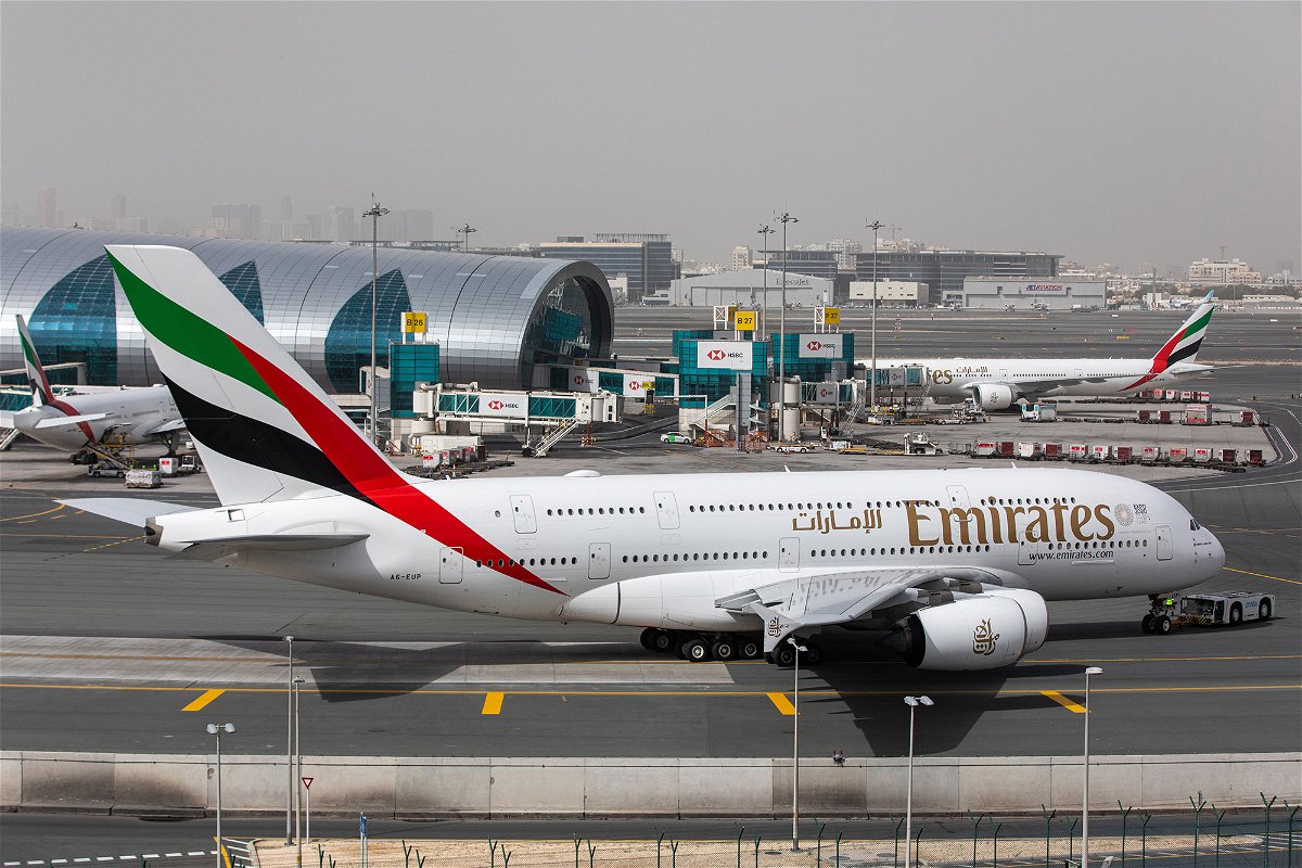 An Airbus A380 operated by Emirates taxis past the terminal at Dubai International Airport in March 2020.