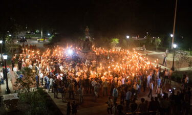 White Supremacists encircle counter protestors at the base of a statue of Thomas Jefferson after marching through the University of Virginia campus with torches in Charlottesville